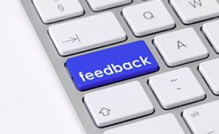Computer keyboard with highlighted feedback key